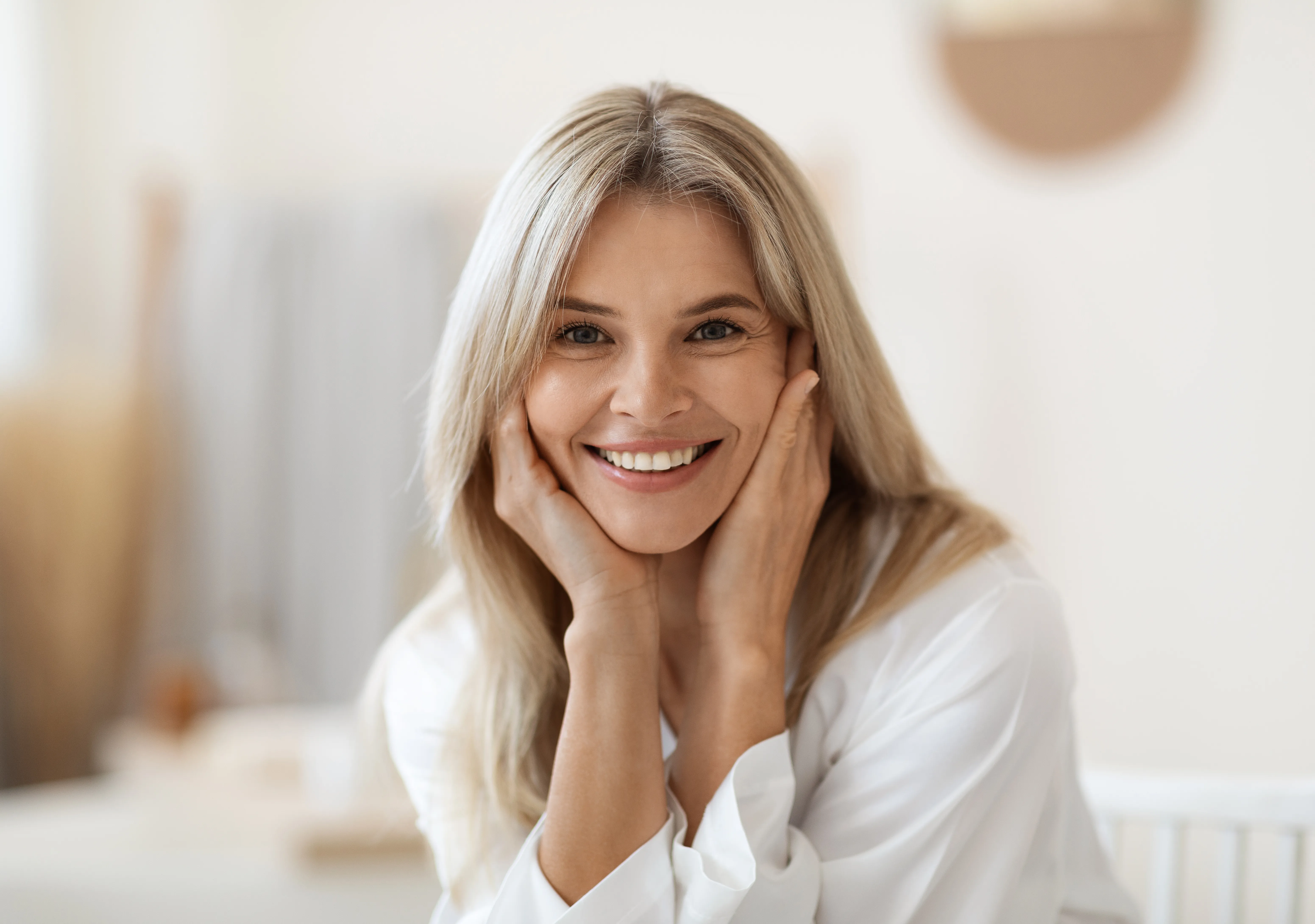 Calm, confident woman enjoying a moment of self-care in natural light